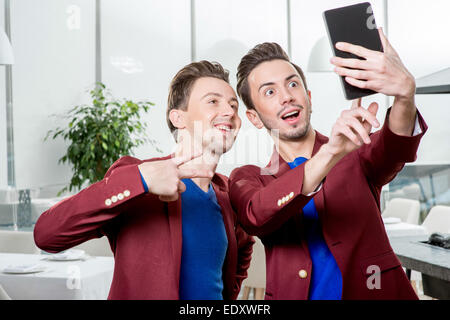 Brothers twins taking selfie photo Stock Photo