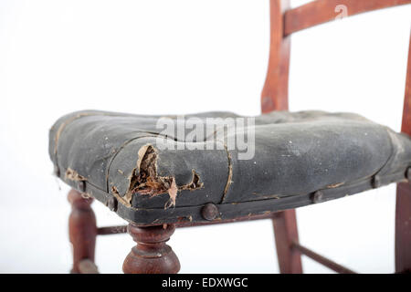 old leather chair in need of restoration Stock Photo