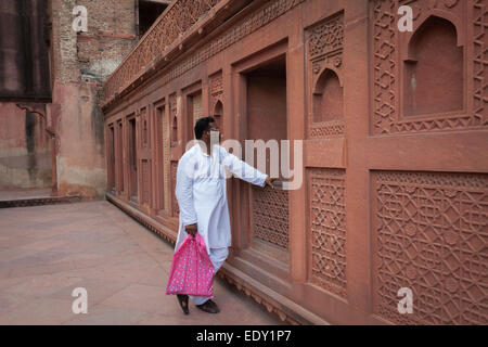 Man wearing mundu, traditional clothes of India. Shahjahani Mahal, inside Agra Red Fort complex. Stock Photo