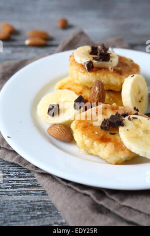 Sweet cottage cheese pancakes with banana, food Stock Photo