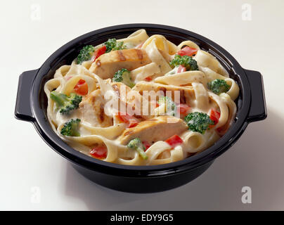 Chicken pasta microwave bowl on white background Stock Photo