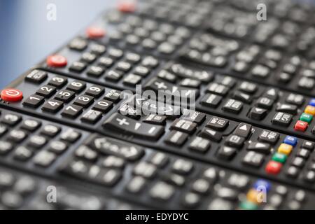 tv remote controls in a row Stock Photo