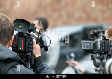 filming an event with a video camera Stock Photo