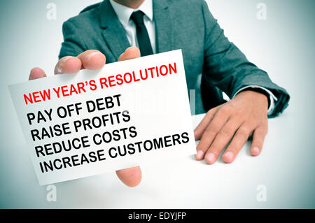 a businessman showing a list of new years resolutions for his business Stock Photo