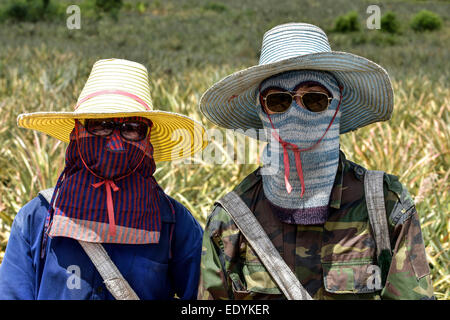 A man and a woman wearing sun protective clothing, Hua Hin, Thailand Stock Photo