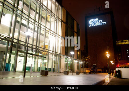 evening shot of Leeds Beckett University signage lit up Stock Photo