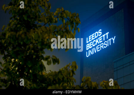 evening shot of Leeds Beckett University signage lit up Stock Photo