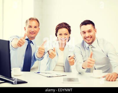 business team showing thumbs up in office Stock Photo