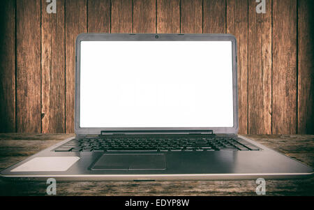 Blank laptop screen on wooden background,selective focus Stock Photo