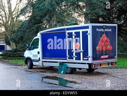 A Tesco delivery van parked in the precinct of Norwich Cathedral, Norfolk, England, United Kingdom. Stock Photo