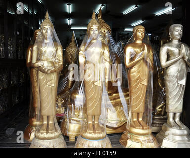 Buddha golden statues packed at manufactury on street in Bangkok, Thailand, Southeast Asia. Stock Photo