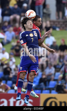Newcastle, Australia. 12th Jan, 2015. Yasuhito Endo (L) of Japan vies for the ball during a Group D match against Palestine at the AFC Asian Cup in Newcastle, Australia, Jan. 12, 2015. Japan won 4-0. Credit:  Qin Qing/Xinhua/Alamy Live News Stock Photo