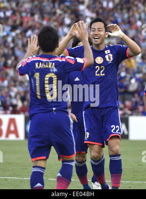 Newcastle, Australia. 12th Jan, 2015. Maya Yoshida (R) of Japan celebrates his goal during a Group D match against Palestine at the AFC Asian Cup in Newcastle, Australia, Jan. 12, 2015. Japan won 4-0. Credit:  Qin Qing/Xinhua/Alamy Live News Stock Photo