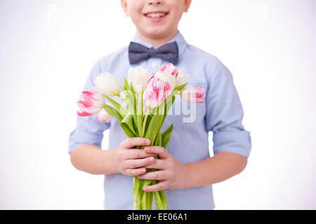 Close-up of cut tulips in hands of a child Stock Photo