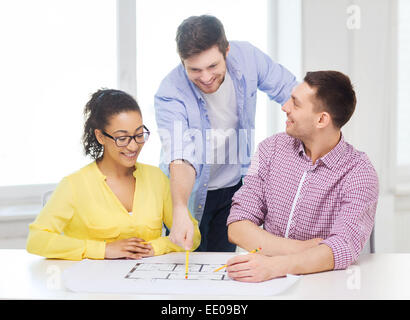 three smiling architects working in office Stock Photo