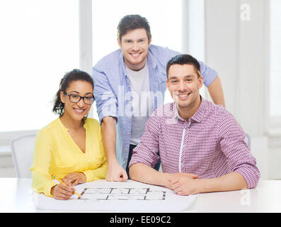 three smiling architects working in office Stock Photo