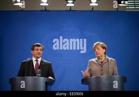 Berlin, Germany. 12th Jan, 2015. Federal Chancellor Angela Merkel (R) and Turkish Prime Minister Ahmet Davutoglu speak at a press conference at the Federal Chancellery in Berlin, Germany, 12 January 2015. Questions of bilateral and European relations as well as economic and international questions were be the main theme of talks over lunch. Credit:  dpa picture alliance/Alamy Live News Stock Photo