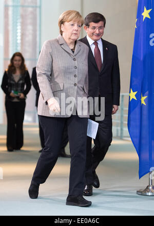 Berlin, Germany. 12th Jan, 2015. Federal Chancellor Angela Merkel (L) and Turkish Prime Minister Ahmet Davutoglu arrive for a press conference at the Federal Chancellery in Berlin, Germany, 12 January 2015. Questions of bilateral and European relations as well as economic and international questions were be the main theme of talks over lunch. Credit:  dpa picture alliance/Alamy Live News Stock Photo