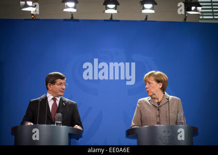Berlin, Germany. 12th Jan, 2015. Federal Chancellor Angela Merkel (R) and Turkish Prime Minister Ahmet Davutoglu speak at a press conference at the Federal Chancellery in Berlin, Germany, 12 January 2015. Questions of bilateral and European relations as well as economic and international questions were be the main theme of talks over lunch. Credit:  dpa picture alliance/Alamy Live News Stock Photo