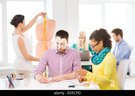 smiling fashion designers working in office Stock Photo