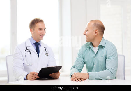 doctor with clipboard and patient in hospital Stock Photo