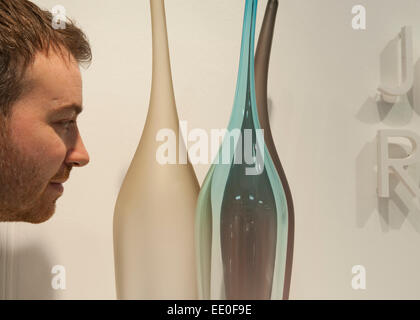 Olympia, London, UK. 12th January, 2015. Top Drawer, Home and Craft gift and fashion accessories trade show runs from 11-13 January where retail buyers can meet innovative exhibitors and designers. Designer Jonathan Rogers with his contemporary hand blown glassware exhibiting in the Talent area. Credit:  Malcolm Park editorial/Alamy Live News Stock Photo