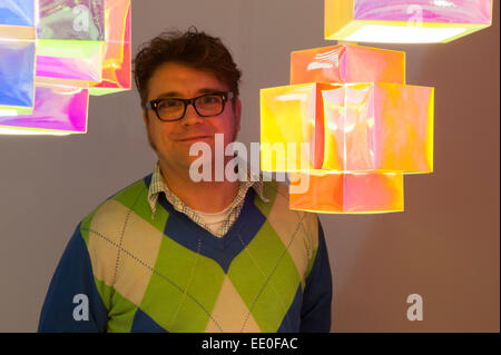Olympia, London, UK. 12th January, 2015. Top Drawer, Home and Craft gift and fashion accessories trade show runs from 11-13 January where retail buyers can meet innovative exhibitors and designers. Designer Toby Sanders of TOBYhouse showcases his lighting Credit:  Malcolm Park editorial/Alamy Live News Stock Photo