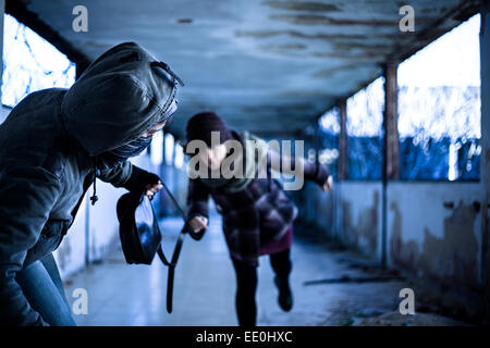 Snatcher Stealing a Bag from a Woman Stock Photo