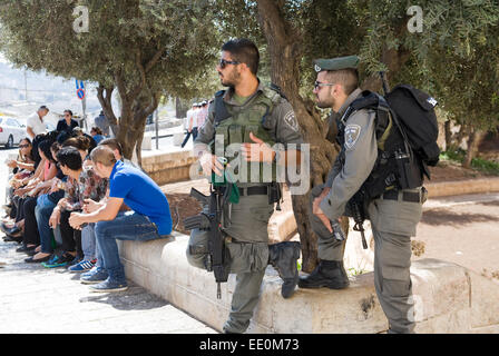 Two police officers taking care of the security on the street just outside the Dung gate of the old city of Jerusalem Stock Photo