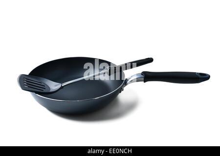 frying pan and spatula on white background Stock Photo