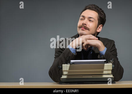 Inspired young author typing Stock Photo