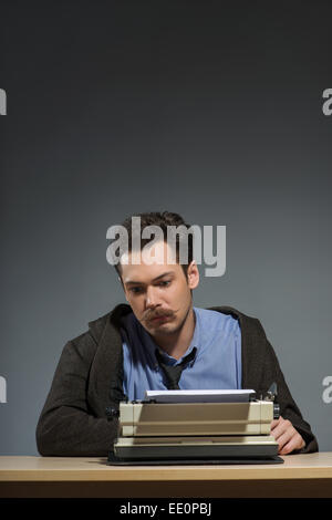 Inspired young author typing Stock Photo