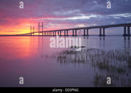 A sunset welsh side of the Severn estuary of the Second Severn Crossing bridge and m4 motorway into England. Stock Photo