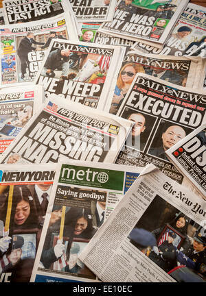 A collection of New York newspapers over several weeks, seen on Monday, January 5, 2015, report on the assassination of NYPD officers Rafael Ramos and Wenjian Liu who were murdered in Brooklyn in their squad car on December 20, 2014 by Ismaaiyl Brinsley allegedly in retaliation for the Eric Garner death. Brinsley killed himself in the subway during his attempted escape. (© Richard B. Levine) Stock Photo