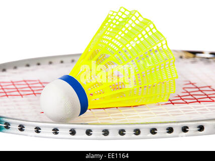 Shuttlecock lying on the badminton racket isolated on white background Stock Photo