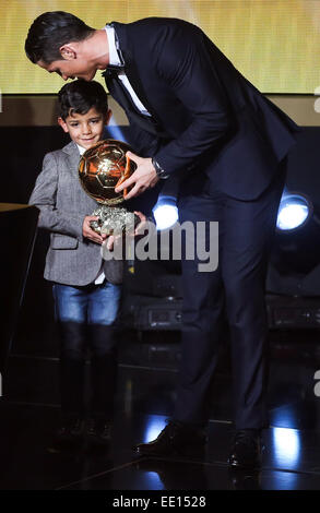 Zurich, Switzerland. 12th Jan, 2015. Real Madrid and Portugal forward Cristiano Ronaldo (R) celebrates with his son on stage after being announced as the winner of the 2014 FIFA Ballon d'Or award for Player of the Year during the FIFA Ballon d'Or award ceremony at the Kongresshaus in Zurich, Switzerland, Jan. 12, 2015. Credit:  Zhang Fan/Xinhua/Alamy Live News Stock Photo