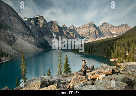 Young woman overlooking Lake Moraine at Banff National Park in Canada Stock Photo