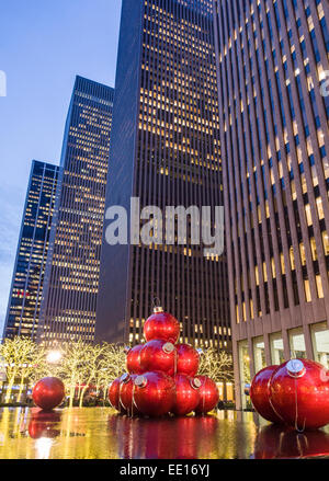 Red Giant Christmas Balls  below the towers. Evening view of huge Christmas balls placed annually in the reflecting pool and fou
