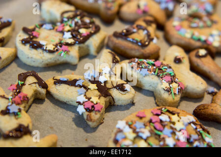 Home made cookies baking paper easter time sweets Stock Photo