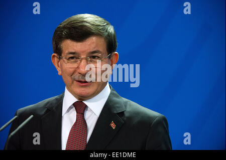 Berlin, Germany. 12th Jan, 2015. Turkish Prime Minister Ahmet Davutoglu speaks at a press conference with German Chancellor Angela Merkel at the Federal Chancellery in Berlin, Germany, 12 January 2015. Questions of bilateral and European relations, as well as economic and international questions were the main theme of talks over lunch. Photo: BERND VON JUTRCZENKA/dpa/Alamy Live News Stock Photo