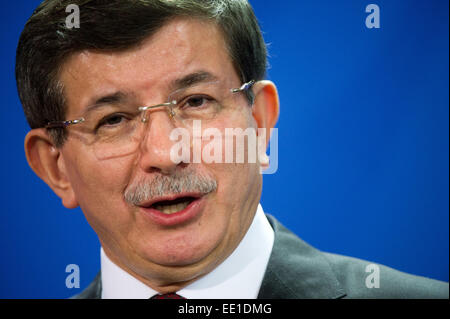 Berlin, Germany. 12th Jan, 2015. Turkish Prime Minister Ahmet Davutoglu speaks at a press conference with German Chancellor Angela Merkel at the Federal Chancellery in Berlin, Germany, 12 January 2015. Questions of bilateral and European relations, as well as economic and international questions were the main theme of talks over lunch. Photo: BERND VON JUTRCZENKA/dpa/Alamy Live News Stock Photo