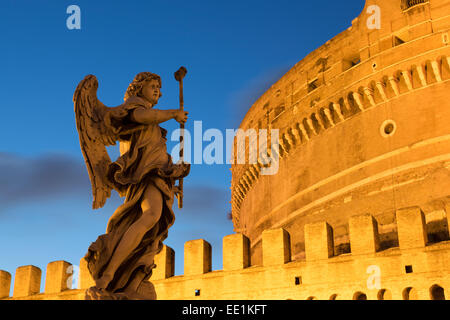 Angel statue on Ponte Sant' Angelo bridge at dusk with Castel Sant' Angelo, Rome, Lazio, Italy, Europe Stock Photo