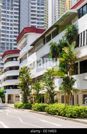 Streamline Moderne architectural style buildings below modern skyscrapers in the Tiong Bahru Estate, Singapore Stock Photo