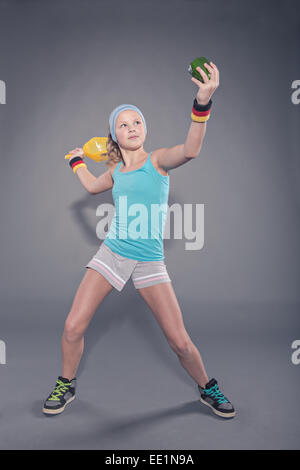 female tennis player with  paprika instead of ball Stock Photo