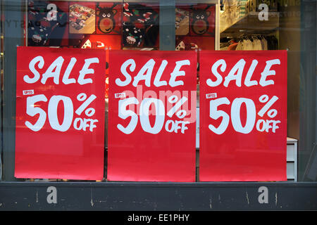 Sale signs in a shop window. Stock Photo