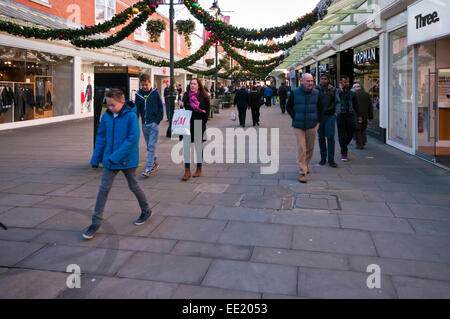 Christmas Shoppers Shopping In Old George Mall Salisbury Wiltshire at Xmas Stock Photo