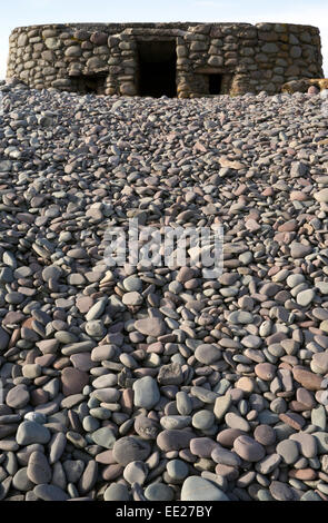 WW2 pillbox machine gun emplacement, camouflaged with pebbles/rocks, on Porlock Beach near Bossington, Somerset, UK Stock Photo