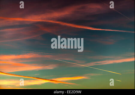 AIRCRAFT CONTRAILS OR EXHAUST EMISSIONS IN A WINTER SKY OVER THE UNITED KINGDOM Stock Photo