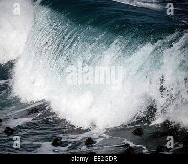 A South Atlantic roller wave breaking in Hermanus, Western Cape, South Africa. Hermanus is famous for whale watching. Stock Photo