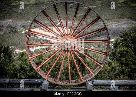 Cast -iron machine wheel at Bendigo gold mine in the Knysna Forest, part of the Garden Route National Park, South Africa. Stock Photo